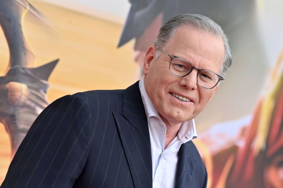 David Zaslav in a striped suit and white shirt.