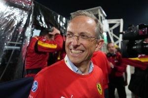 Ferrari CEO Benedetto Vigna in a red Ferrari shirt.