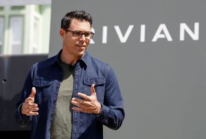 Rivian CEO RJ Scaringe in a navy blue casual shirt